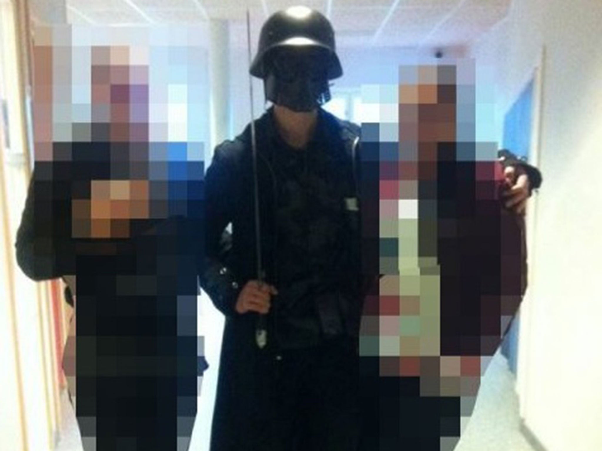 The attacker was dressed as Darth Vader and posed with students just before the attack