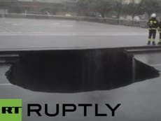 Huge sinkhole swallows car in Italy