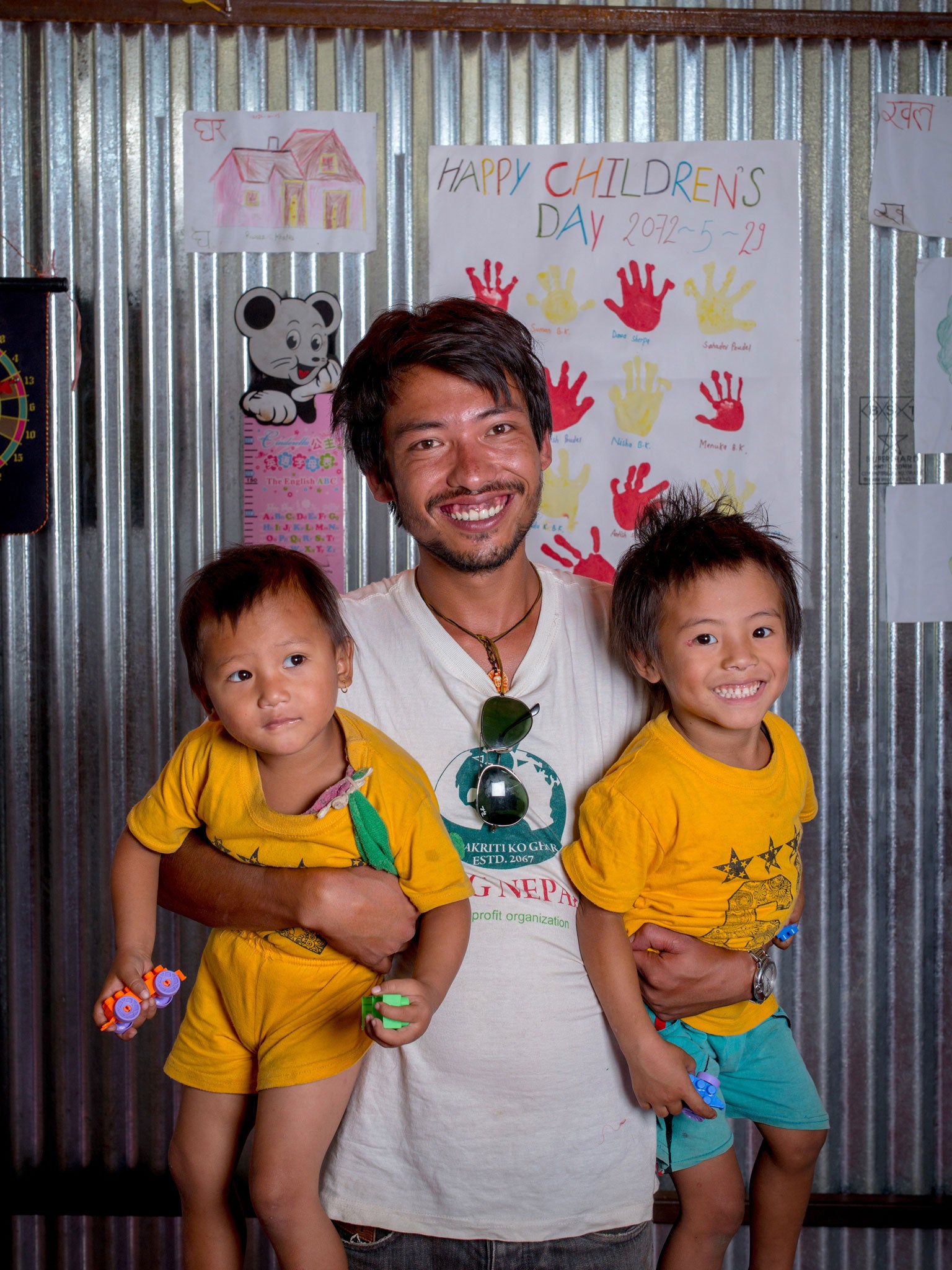 Madan Poudel with four-year-olds Ashim (on left) and Sonam at Bude Camp