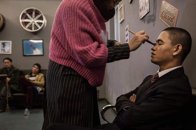 Xiao Jinguo makes his living impersonating U.S. President Barack Obama
