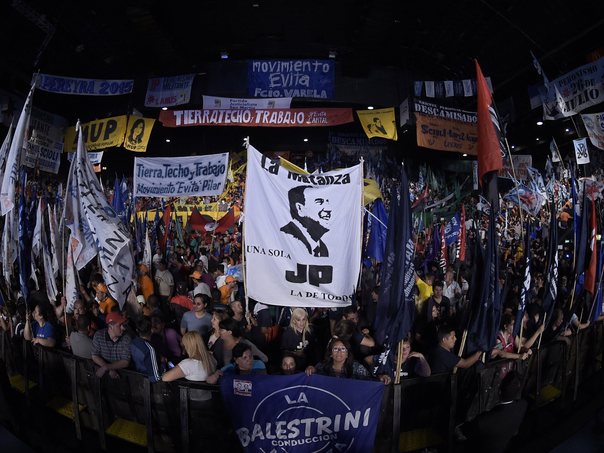 Supporters of the ruling party’s candidate, Buenos Aires governor Daniel Scioli, who is Cristina Kirchner’s chosen successor, at the Luna Park rally