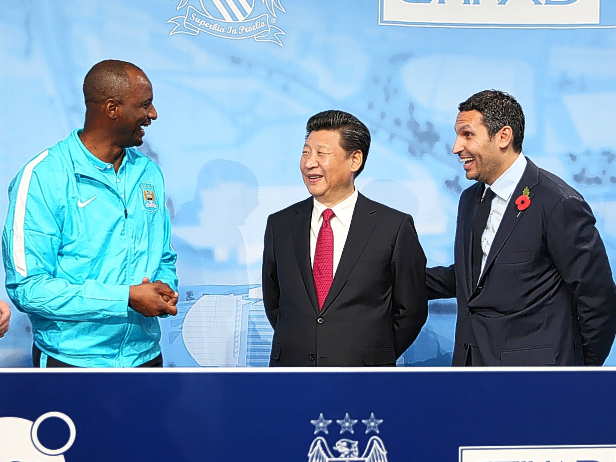 Manchester City’s Elite Development Squad head coach Patrick Vieira, Chinese President Xi Jingping and City Chairman Khaldoon Al Mubarack during a visit to the City Football Academy in Manchester