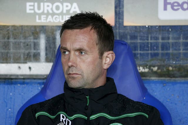 Ronny Deila sits on the bench before Celtic'sEuropa League Group A match against Molde