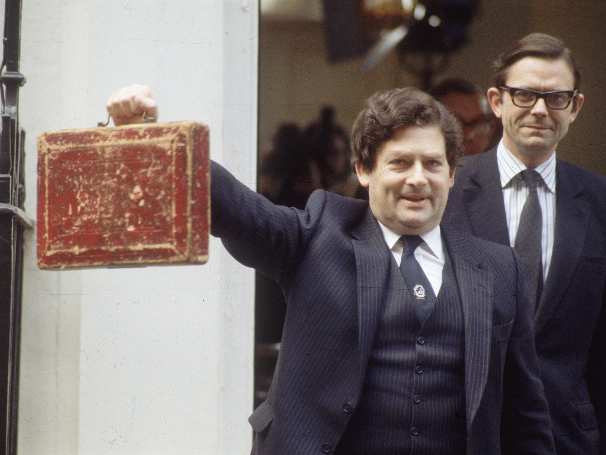 Former Chancellor of the Exchequer, Nigel Lawson, holding the famous Budget Box aloft outside Downing Street in 1984