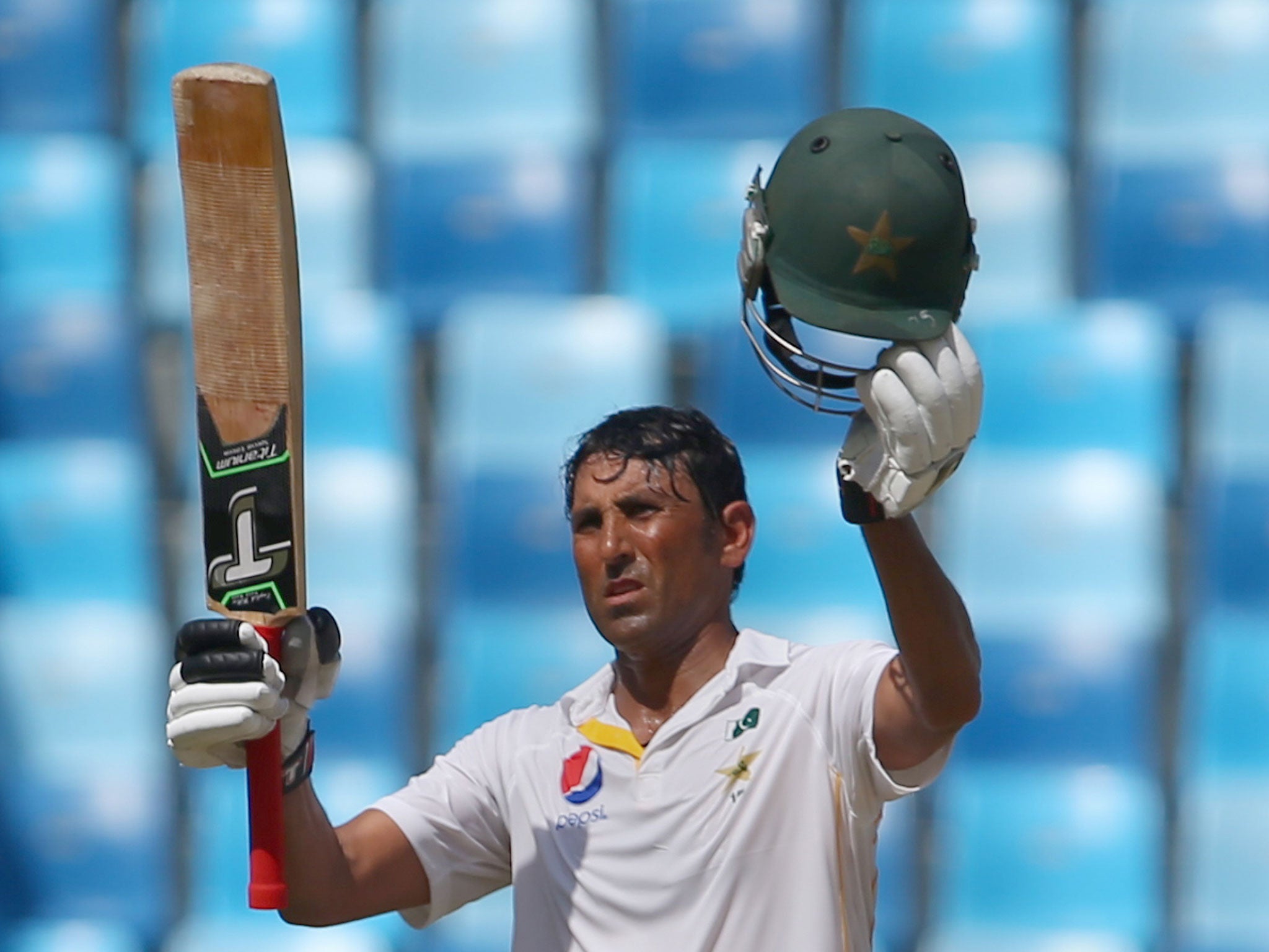 Younes Khan celebrates reaching his century to give Pakistan a commanding lead over England