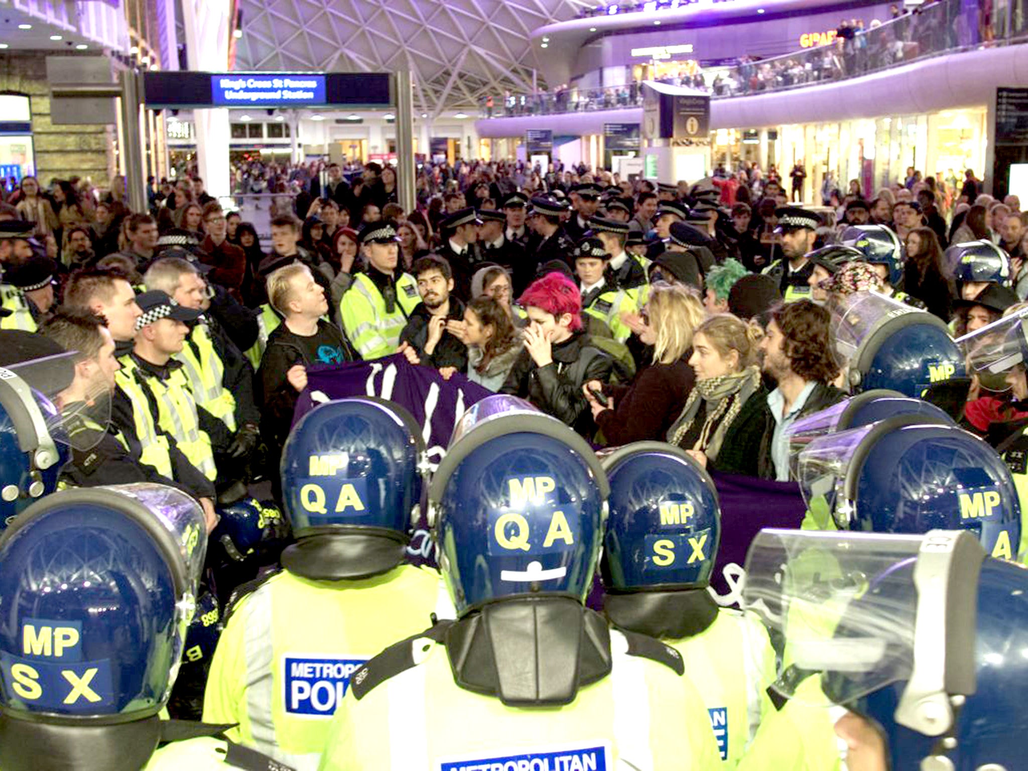 Police and No Borders protesters in a stand off at Kings Cross Sta Pancras station