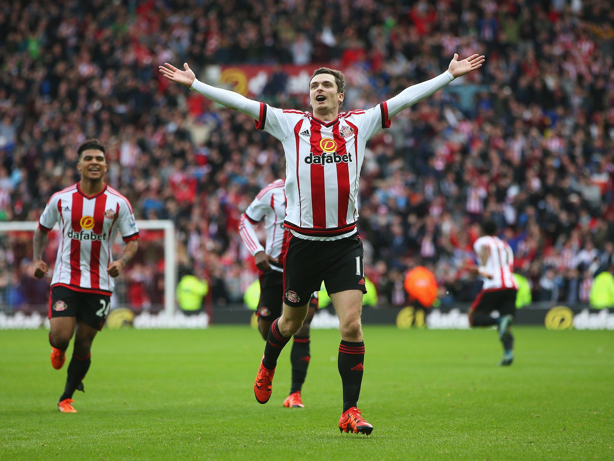 Adam Johnson celebrates his goal in front of the Newcastle fans