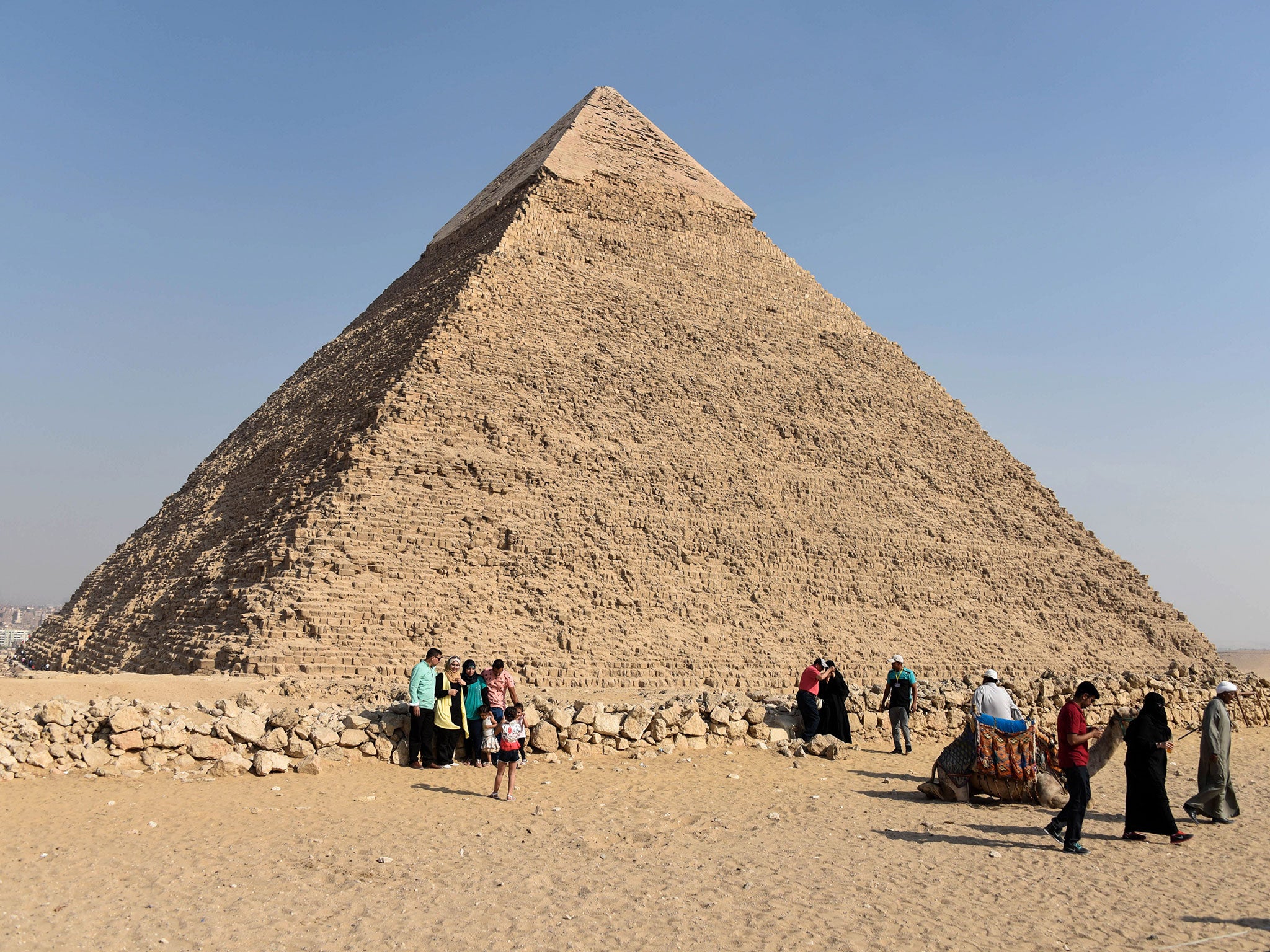 Tourists visit the Giza pyramids, on the southern outskirts of the Egyptian capital, Cairo
