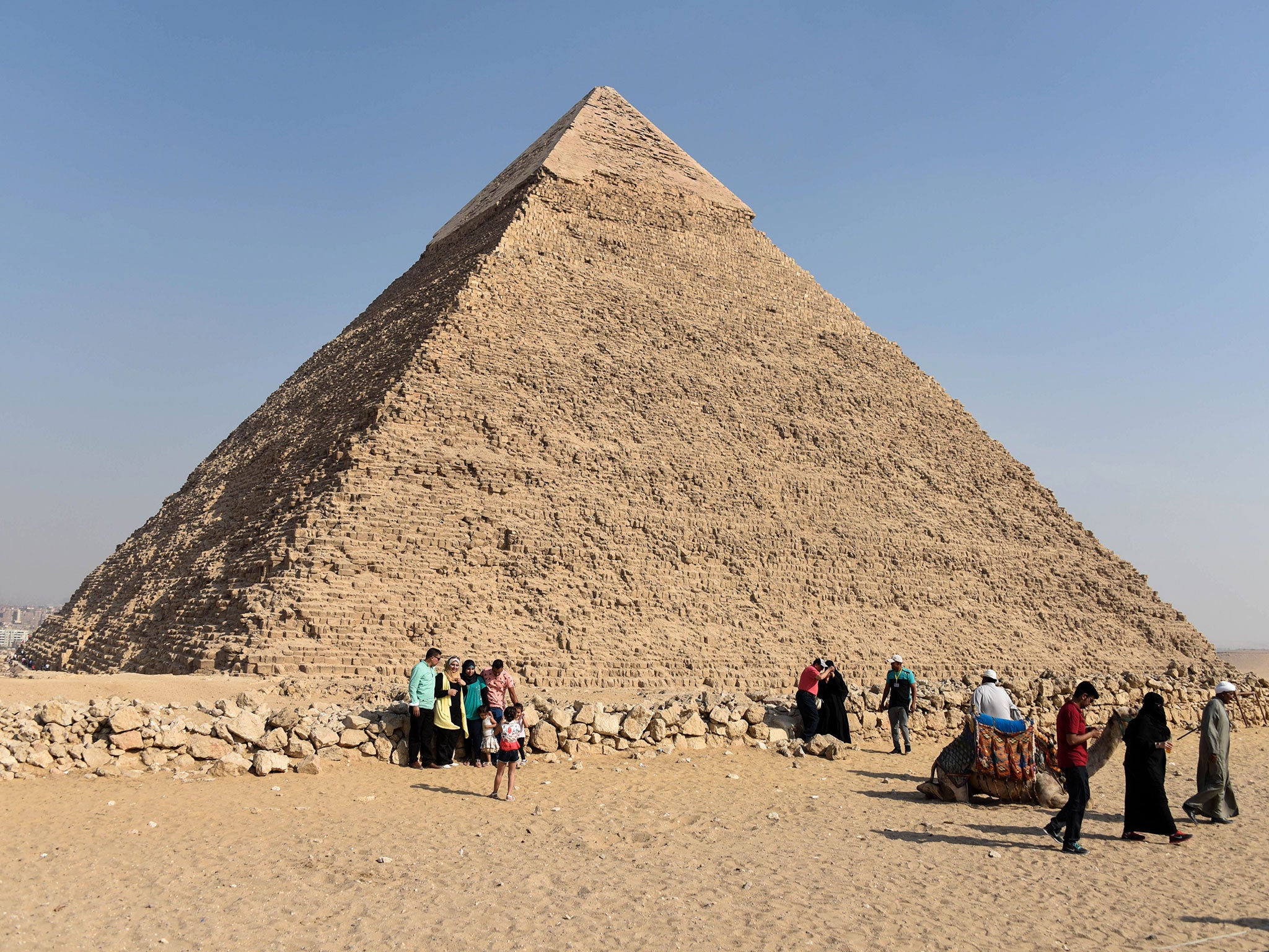 Tourists visit the Giza                pyramids, on the southern outskirts of the Egyptian                capital, Cairo