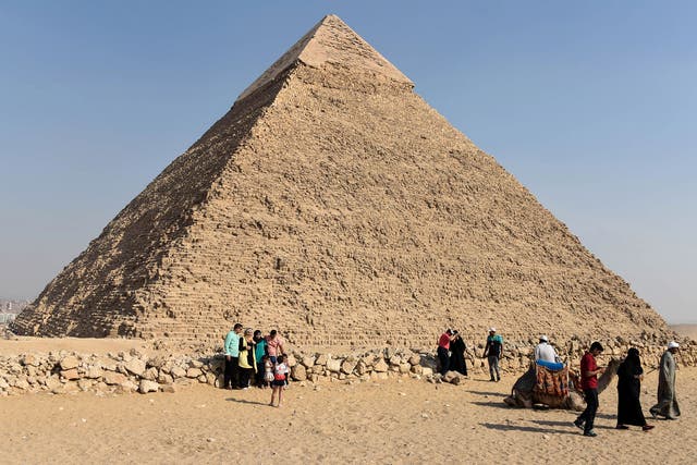 Tourists visit the Giza pyramids, on the southern outskirts of the Egyptian capital, Cairo