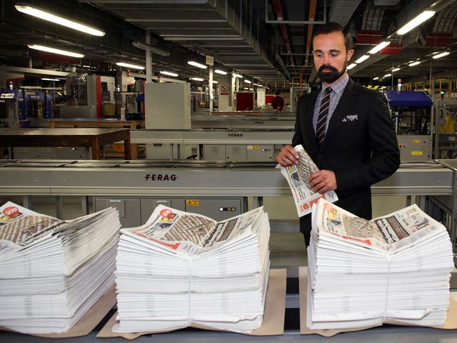 Evgeny Lebedev pictured with the first ever printed copies of the 'i' off the press
