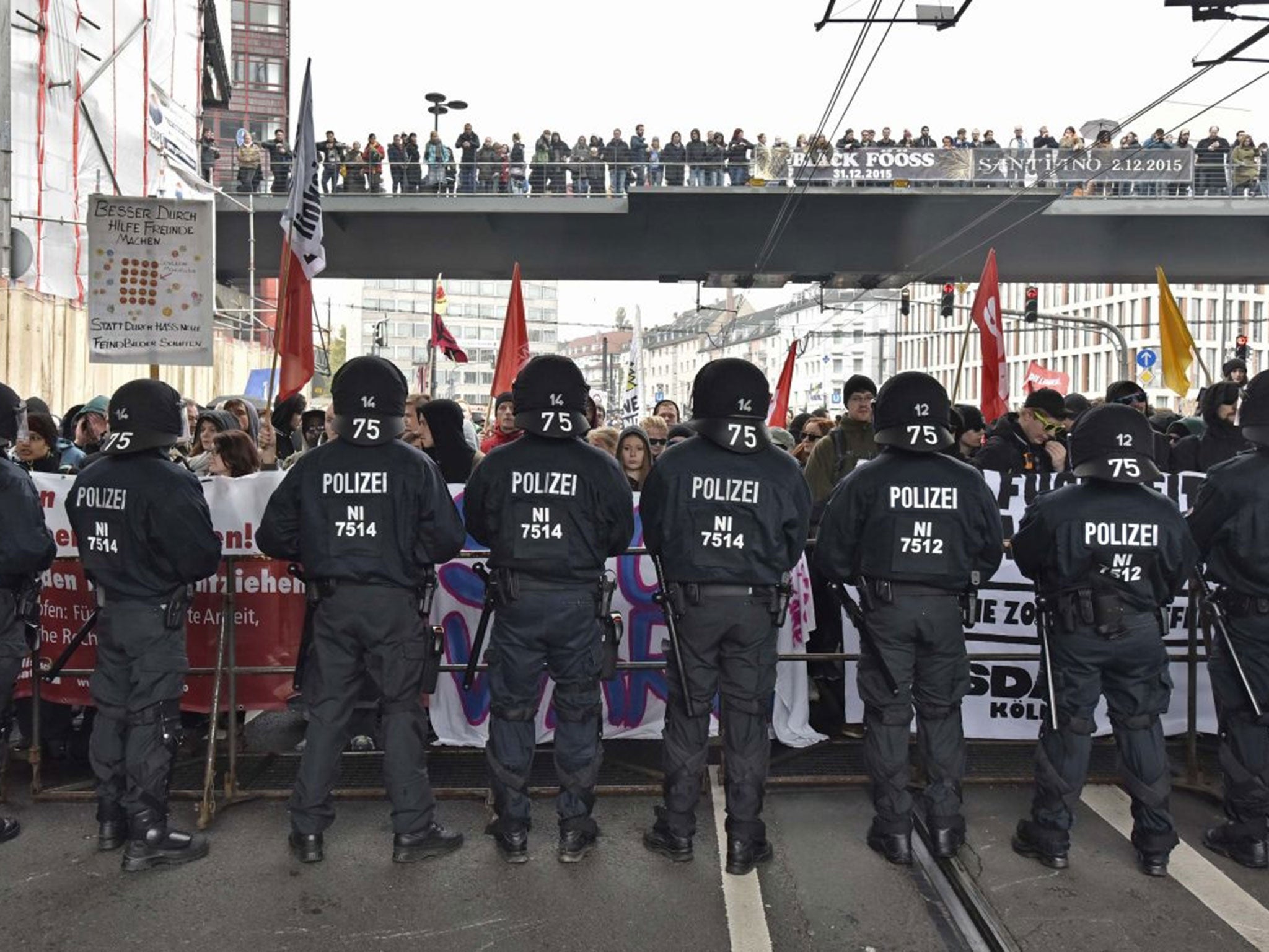 Police secure streets during a counter demonstration against far-right groups in Cologne, Germany, Sunday Oct. 25, 2015. A demonstration, organized by far-right groups and members of Germanyís football hooligan scene, named HOGESA, is observed by 3,500 policemen to secure the demonstration and counter protests in the city.