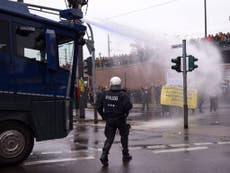 German police spray protesters with water cannon in Cologne
