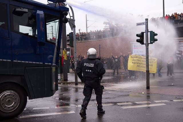 Police use water cannon against counter demonstrators protesting a Hogesa demonstration in Cologne, Germany, 25 October 2015. The Hooligans gegen Salafisten (Hogesa, Hooligans against Salafists) group is holding a demonstration in Cologne, while several counter demonstrations and events are also planned. In total, police are expecting up to 23,000 demonstrators.