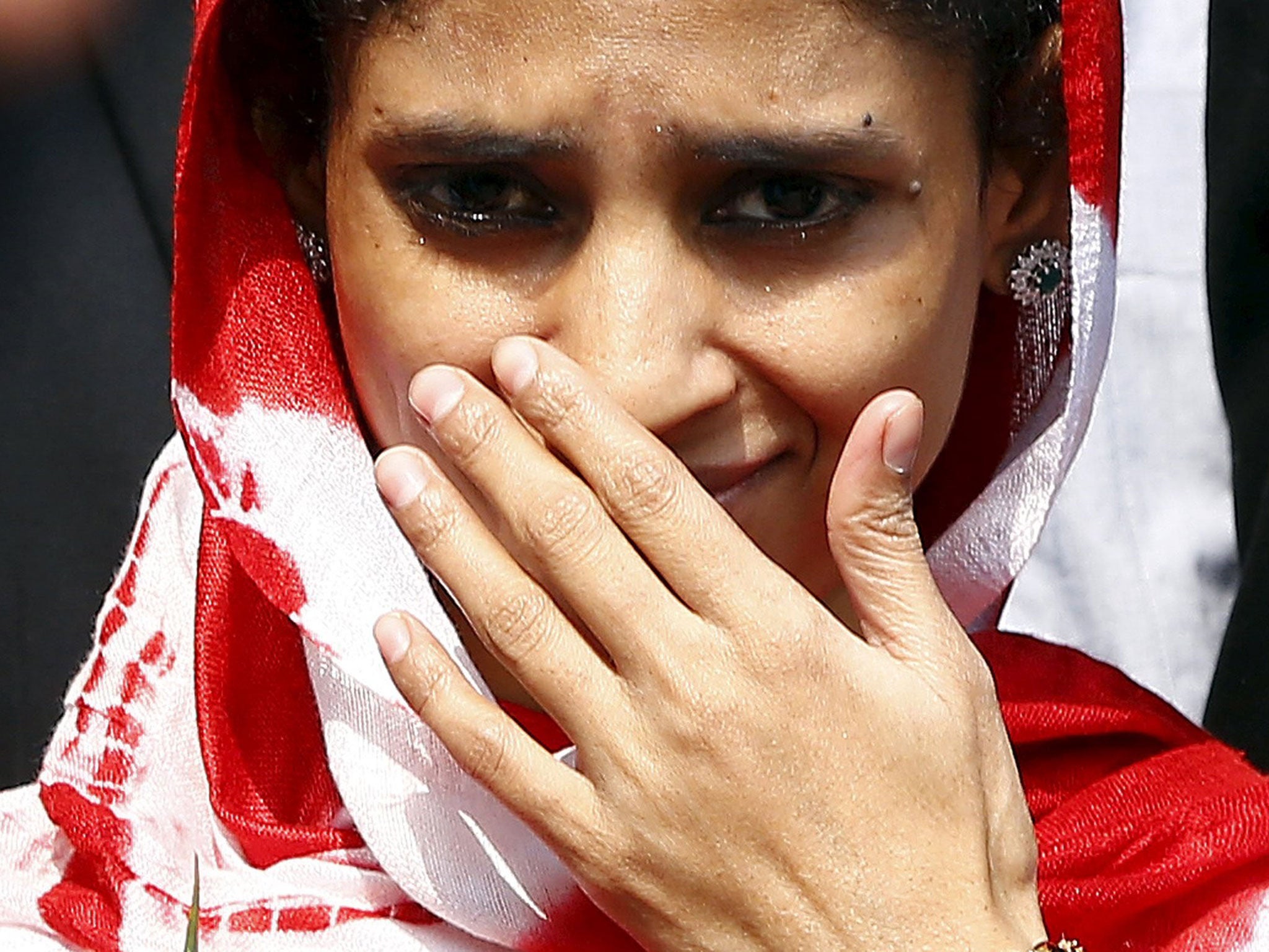 Geeta gestures as she comes out from an airport after her arrival in New Delhi, India, October 26, 2015