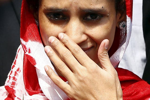 Geeta gestures as she comes out from an airport after her arrival in New Delhi, India, October 26, 2015