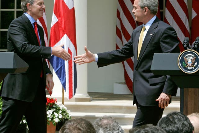 Tony Blair and George W. Bush shake hands after a news conference in 2007 Getty