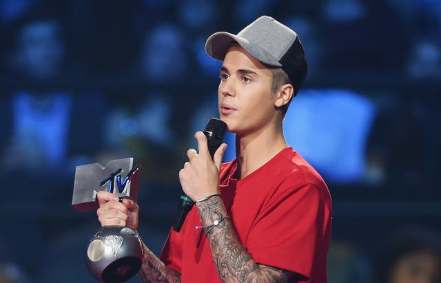 Justin Bieber picking up an award at the MTV EMAs