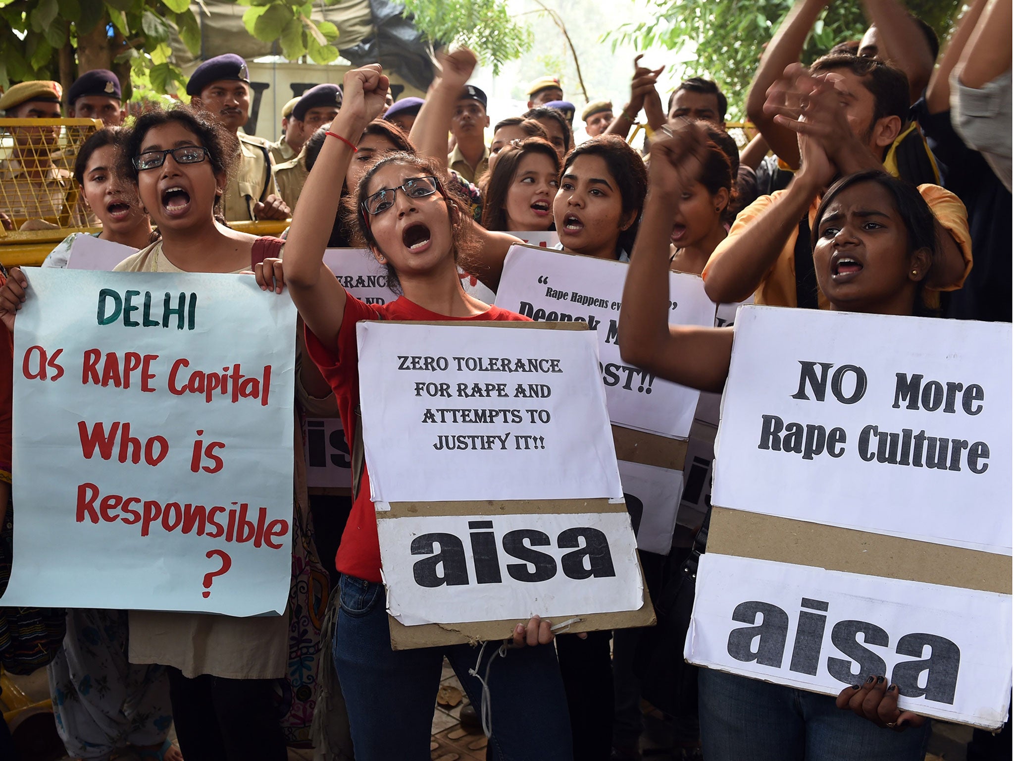 Indian students shout slogans during a protest against the rapes of two minor girls outside the police headquarters in New Delhi on 18 October, 2015