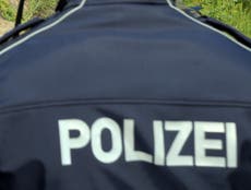 Knife-wielding German policeman 'chases' Brits crossing road slowly
