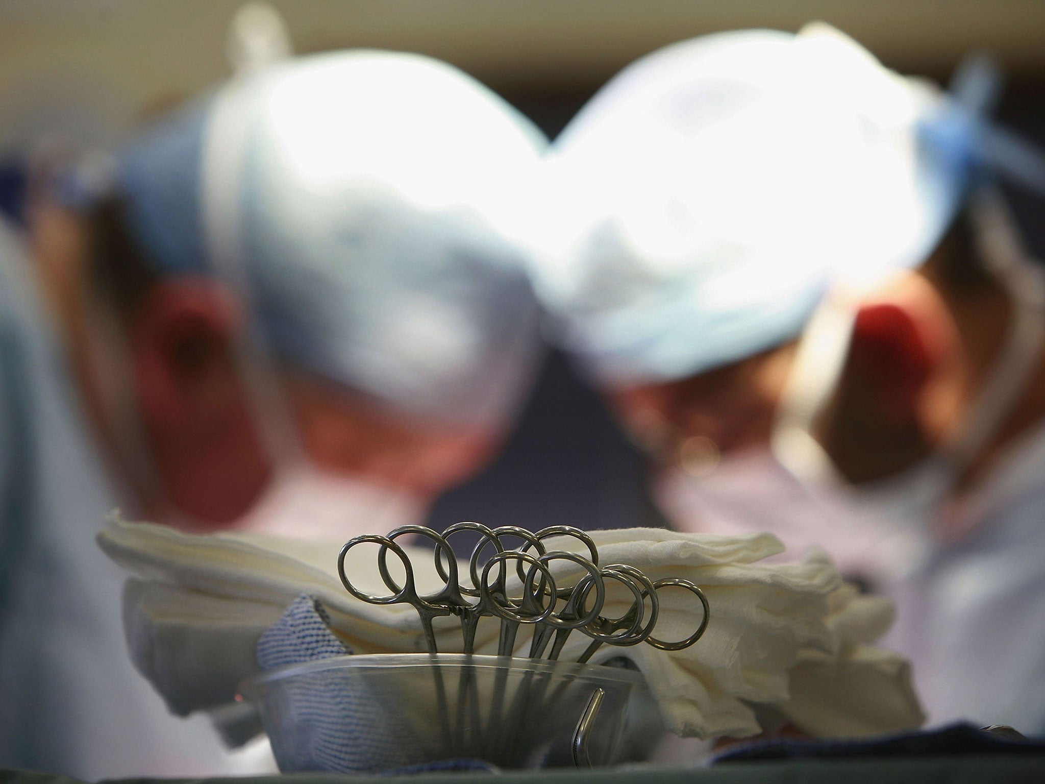 Surgeons conduct an operation