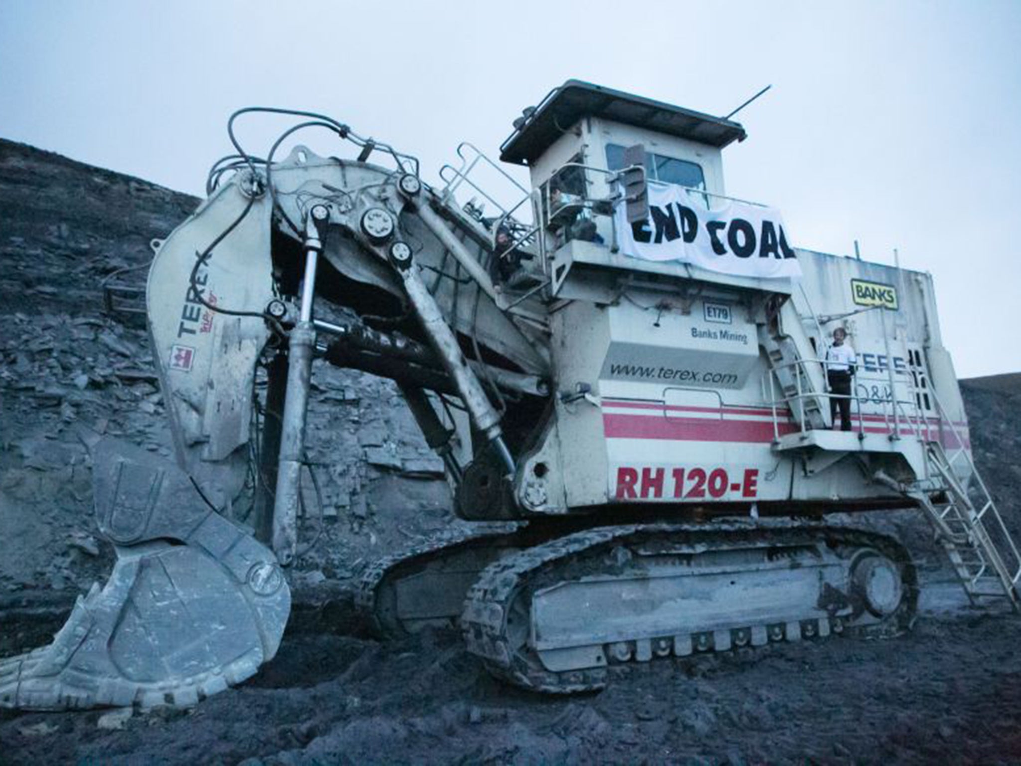 Members of a protest group called Matt Ridley’s Conscience chained themselves to a giant excavator