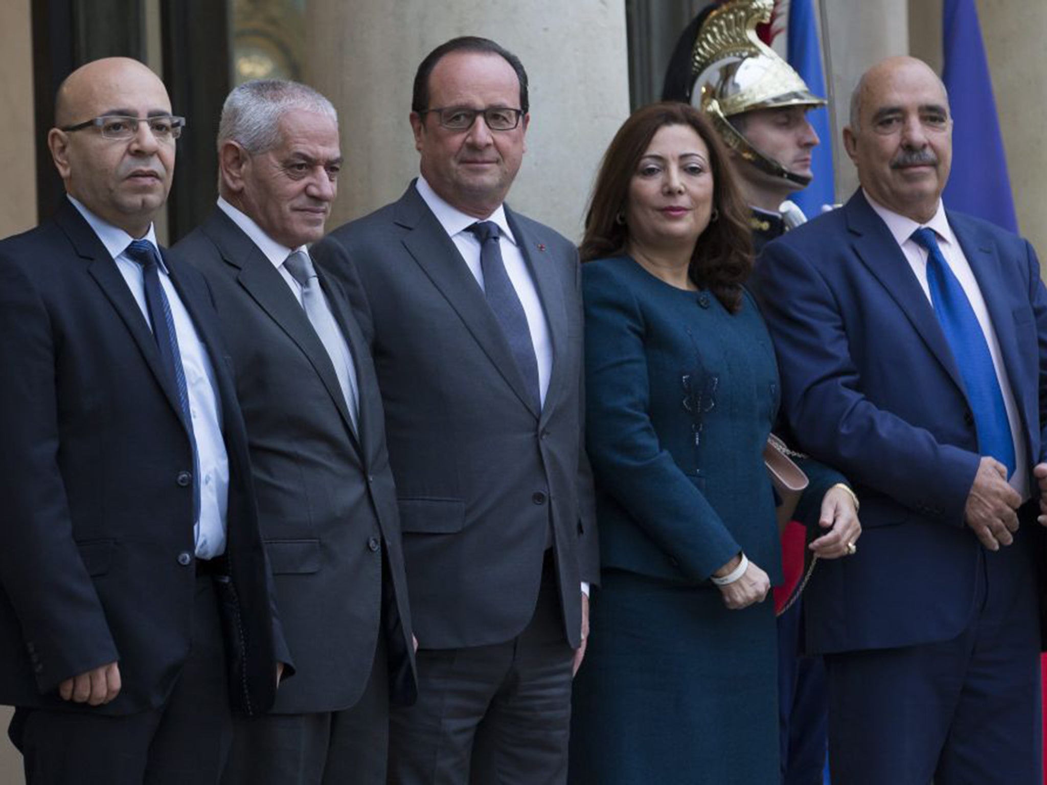 The Nobel Peace Prize was awarded to the Tunisian National Dialogue Quartet, pictured here with French President Francois Hollande, centre