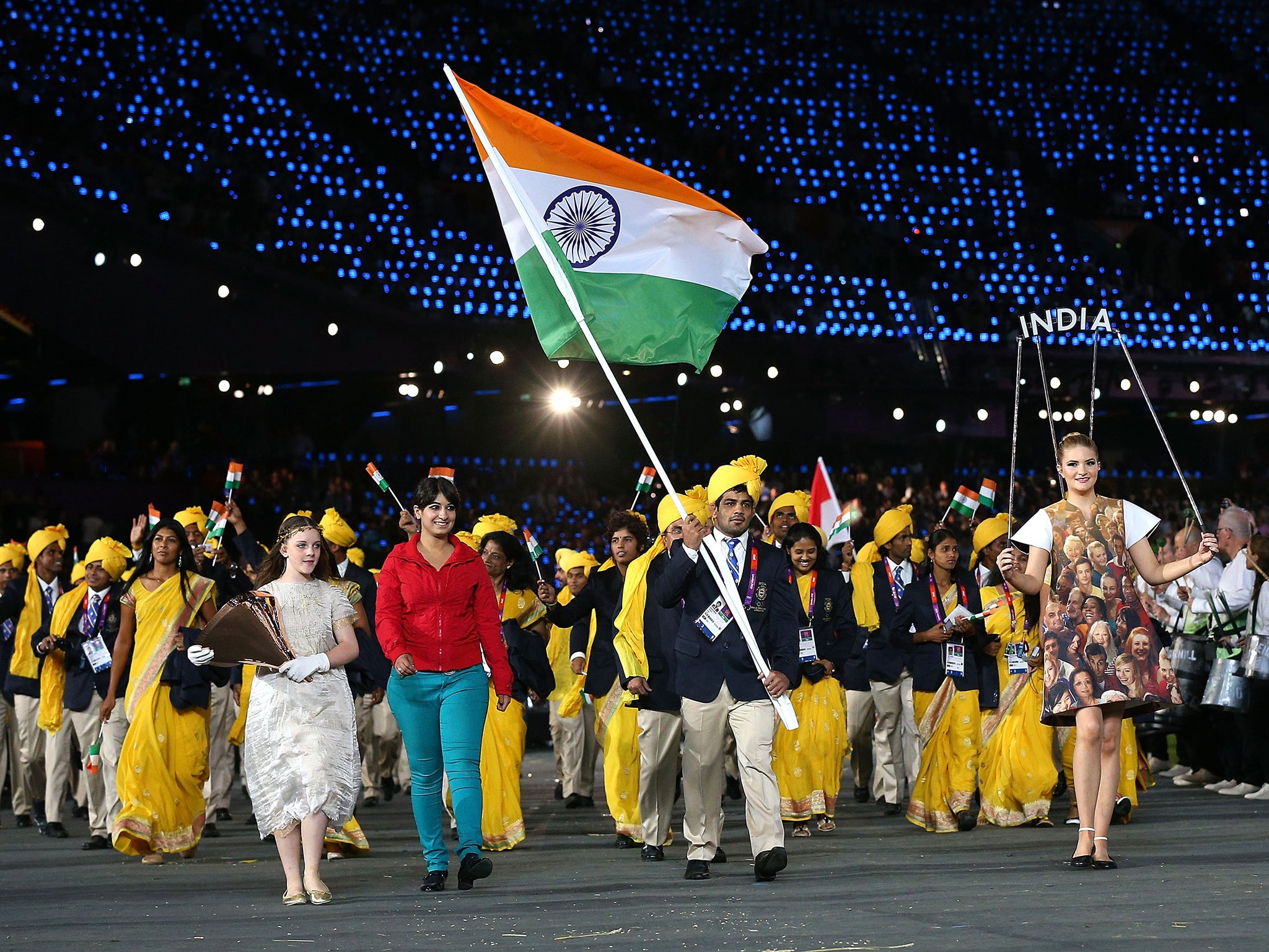 Sushil Kumar of the India Olympic wrestling team carrying his country's flag during the Opening Ceremony of the London 2012 Olympic Games. India is set to be the world’s second largest economy within the next 35 years