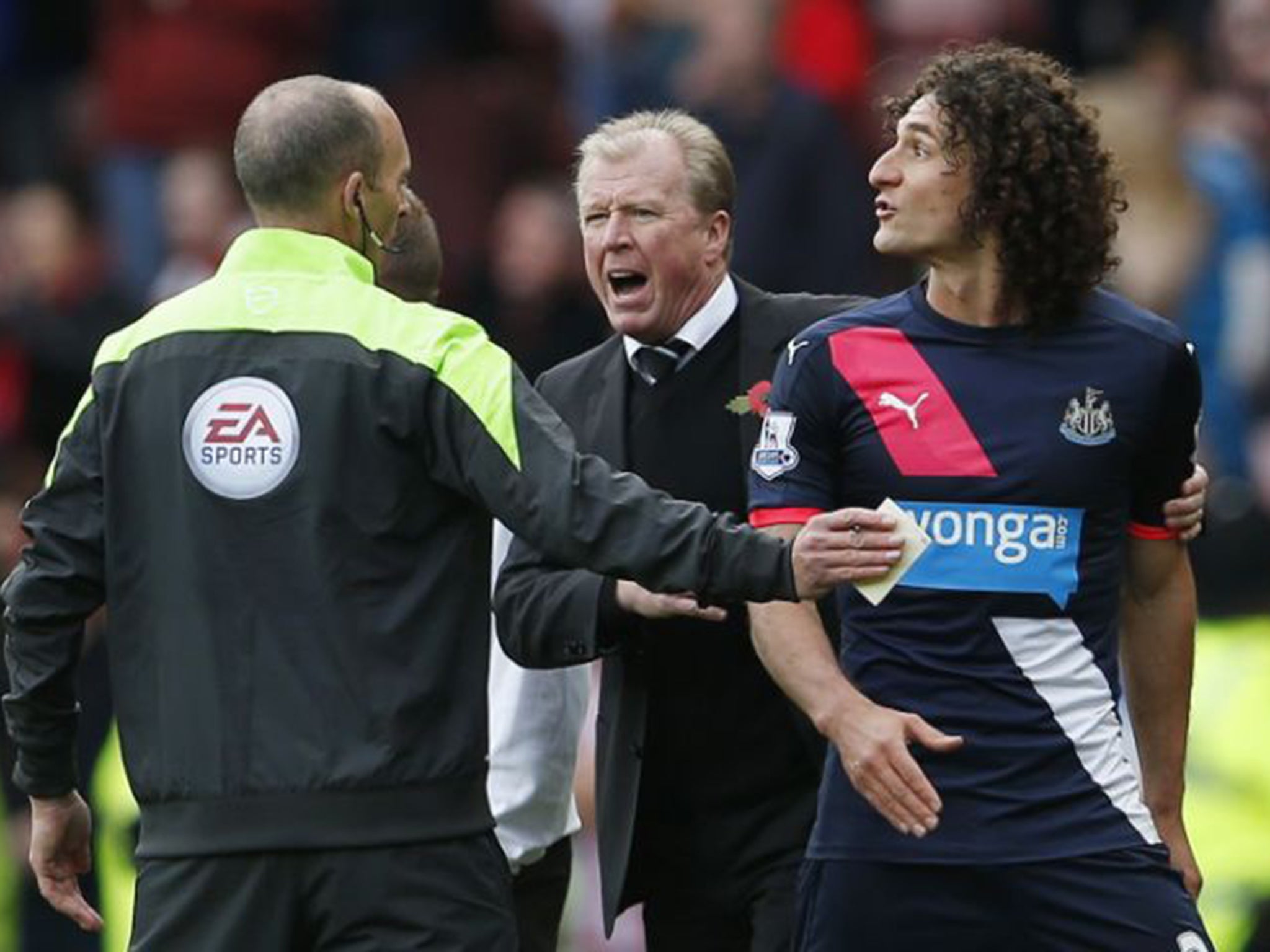 Newcastle captain Fabricio Coloccini is shown the red card before half-time for barging Steven Fletcher