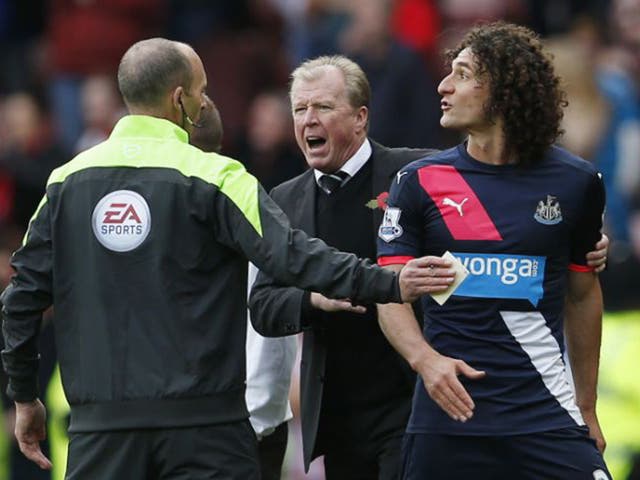 Newcastle captain Fabricio Coloccini  is shown the red card before half-time for barging Steven Fletcher