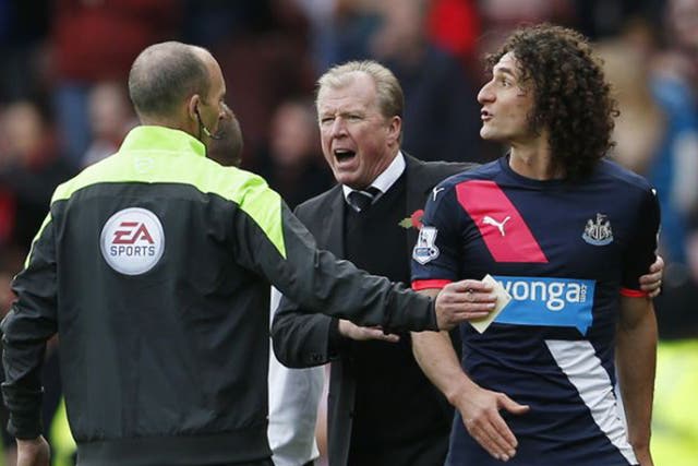 Newcastle captain Fabricio Coloccini  is shown the red card before half-time for barging Steven Fletcher