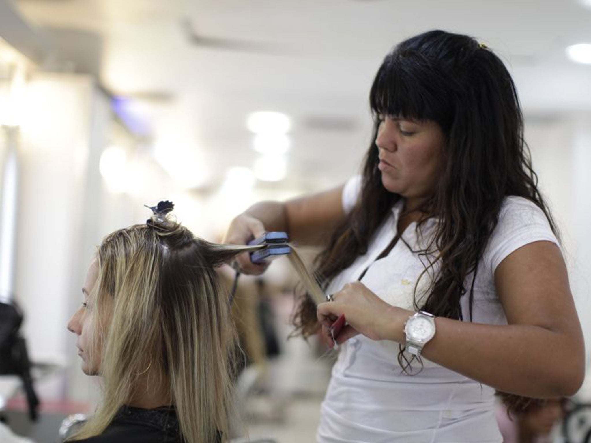 The chemical exposure associated with working as a hairdresser or barber makes it a risk (AP)