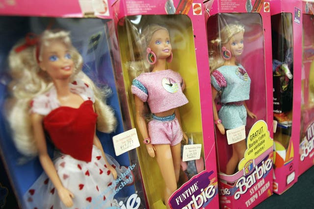 Barbies wait to be sold at Christie's auction house in London