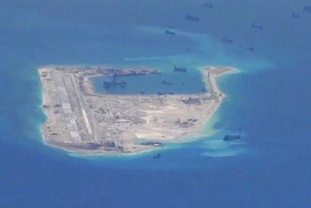 Chinese dredging vessels are purportedly seen in the waters around Fiery Cross Reef in the disputed Spratly Islands in the South China Sea, November, 2015