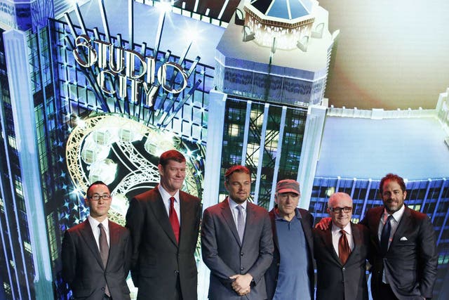 From left, Melco Crown Entertainment's co-chairman and chief executive officer Lawrence Ho and co-chairman James Packer pose with film stars Leonardo DiCaprio, Robert De Niro, director Martin Scorsese and producer Brett Ratner during a launch ceremony of the Studio City project in Macau, Tuesday, Oct. 27, 2015.