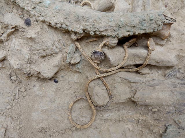 A long gold chain, decorated with semi-precious stones, was found in a 3,500-year-old warrior’s tomb