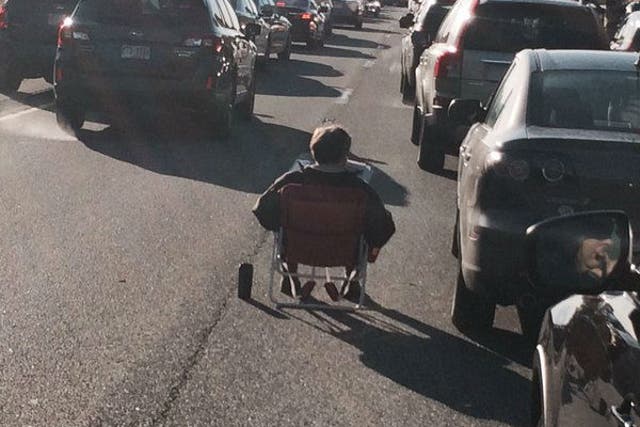 The man got out  lawn chair on the I-95