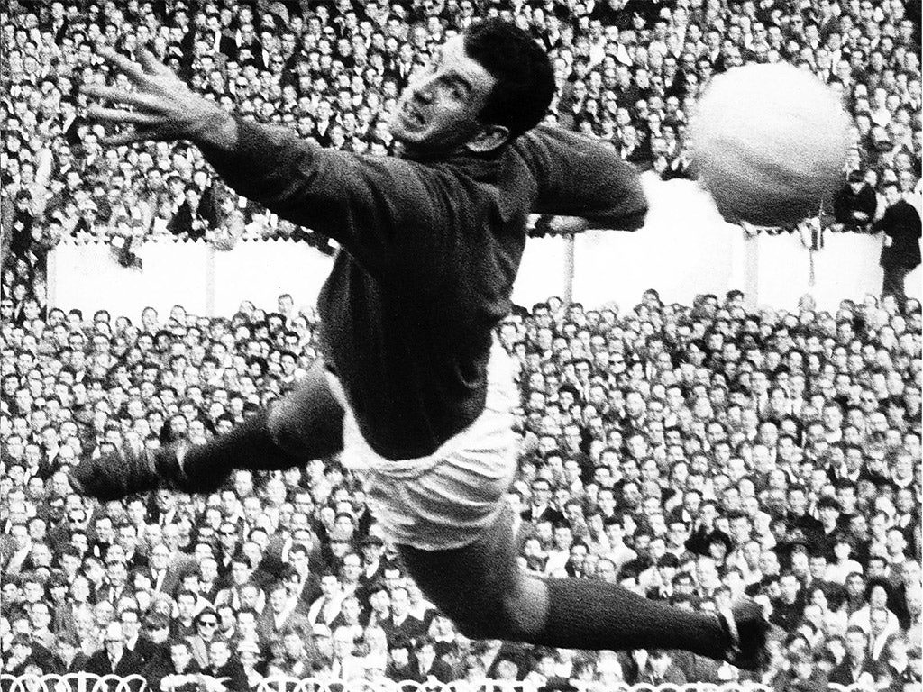 Dunne makes a save for Manchester United against Spurs in 1965