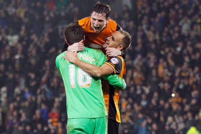 Hull City's David Meyler (right) and Andrew Robertson celebrate with goalkeeper Eldin Jakupovic