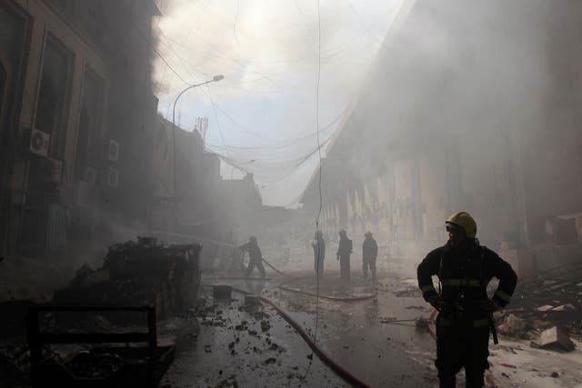 Firefighters extinguish fire from Baghdad from a bomb attack earlier this year