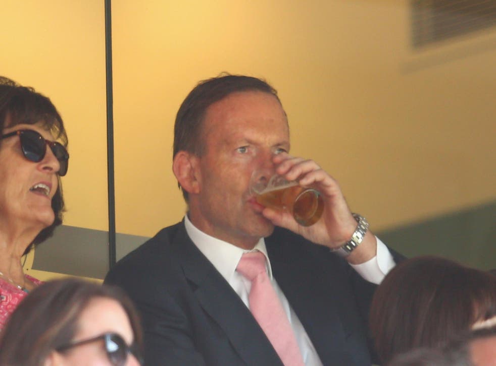 Former Australian prime minister Tony Abbott, drinking a beer