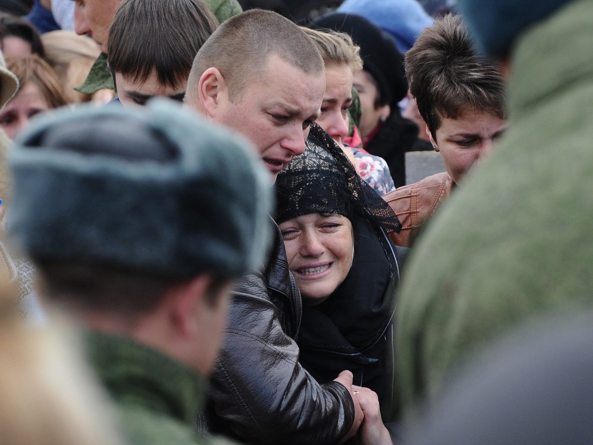 Mr Kostenko’s mother, Svetlana (centre), at the soldier's funeral