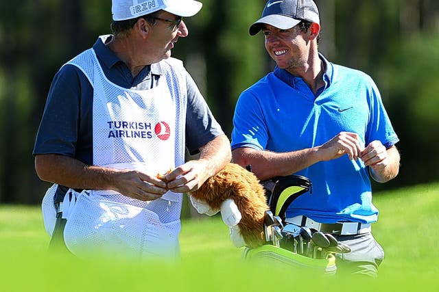 Rory McIlroy shares a joke with his caddie, JP Fitzgerald, during practice for the Turkish Airlines Open