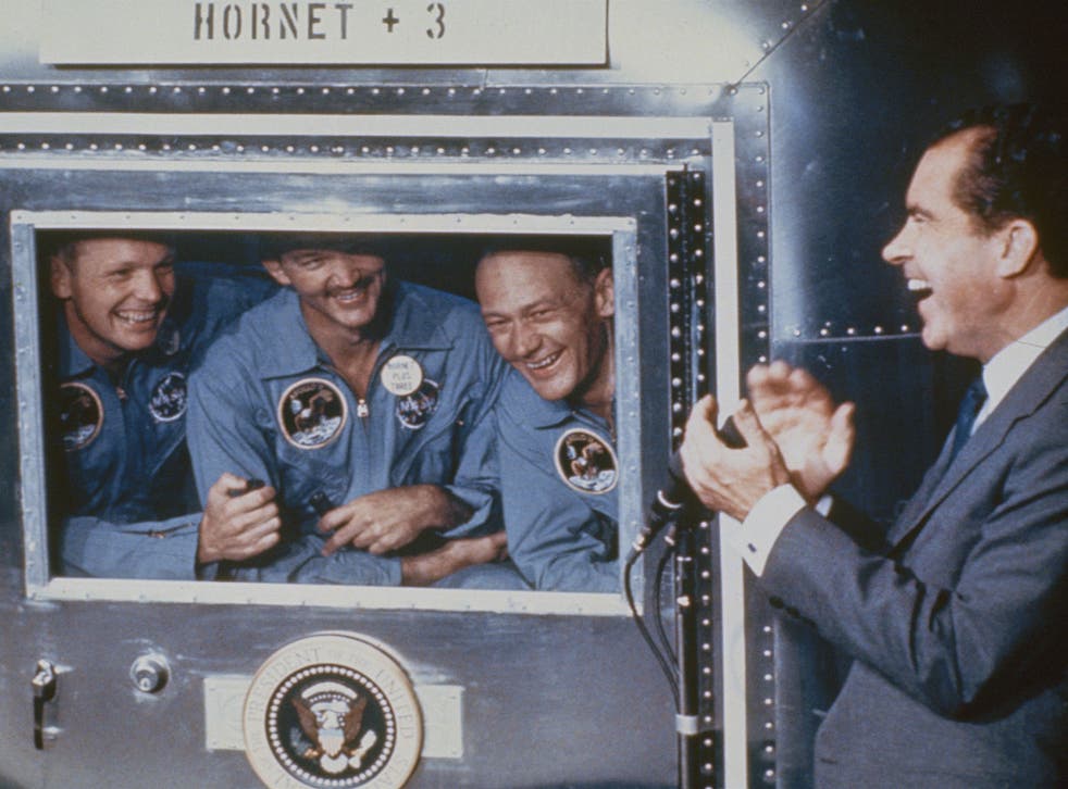 Michael Collins is flanked by Neil Armstrong (left) and Buzz Aldrin as President Nixon greets the returning Apollo XI crew in July 1969