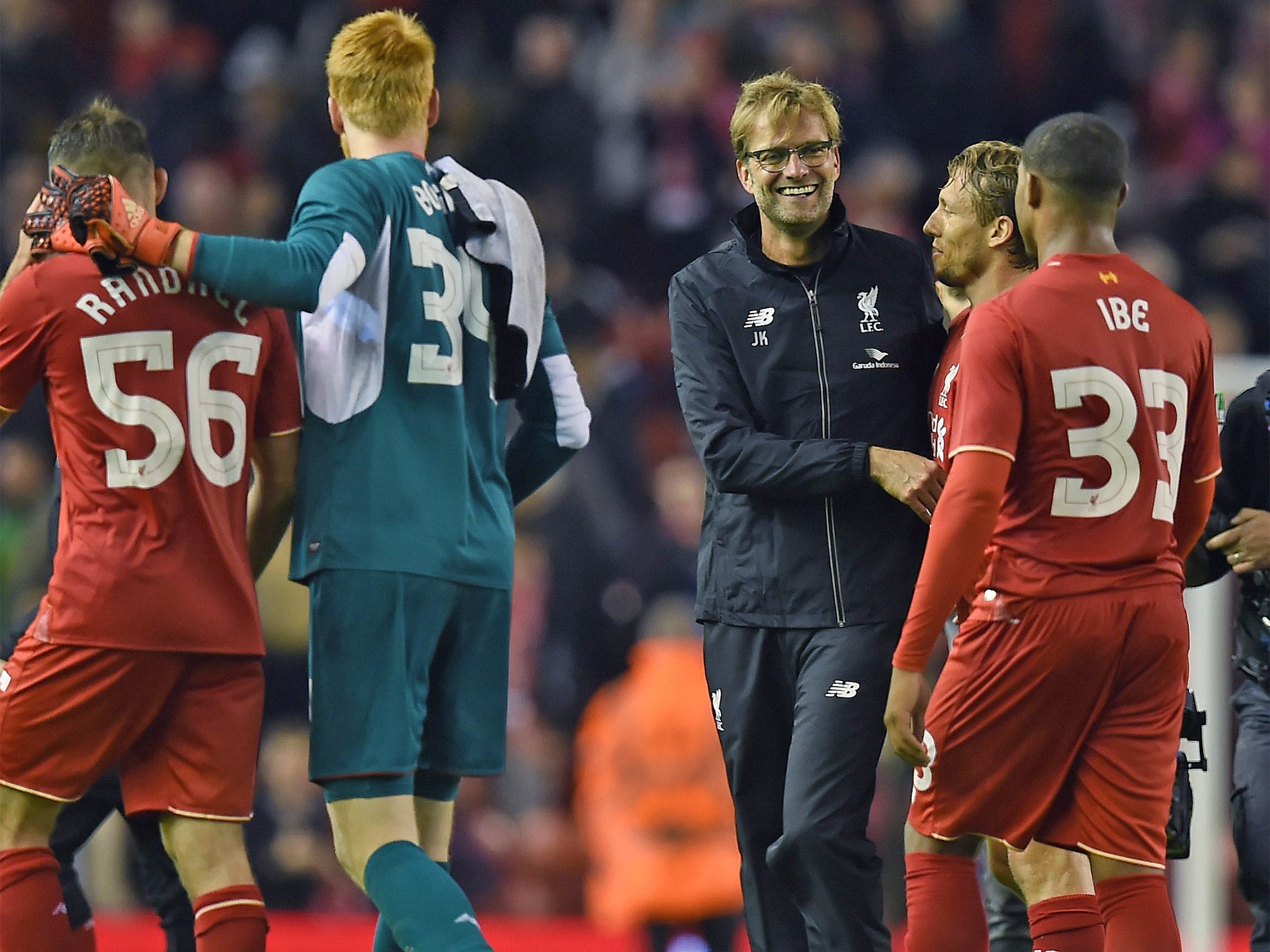 Jurgen Klopp congratulates his players following their victory - his first since taking over at Liverpool