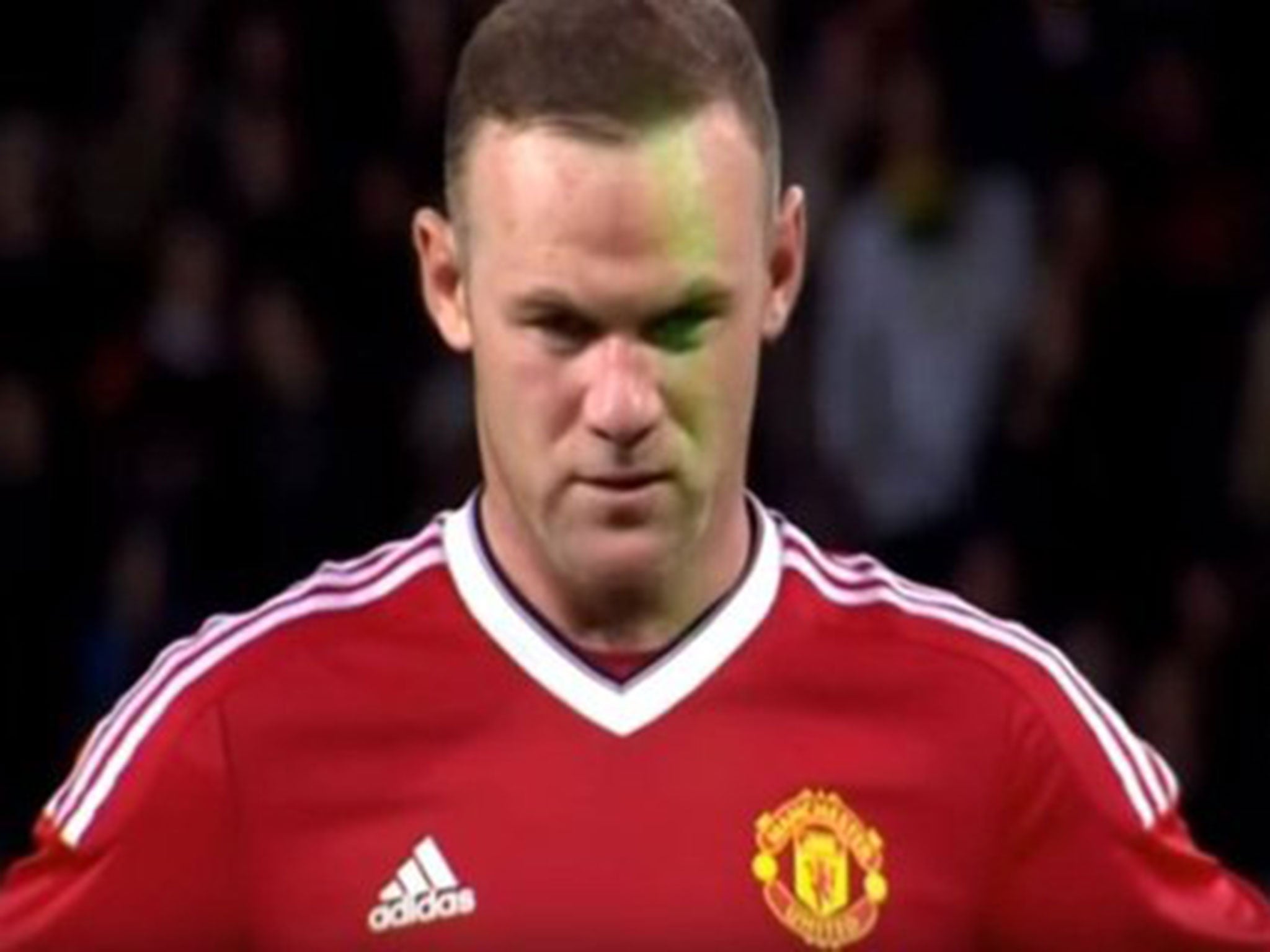Wayne Rooney has a laser shone in his face before taking his penalty