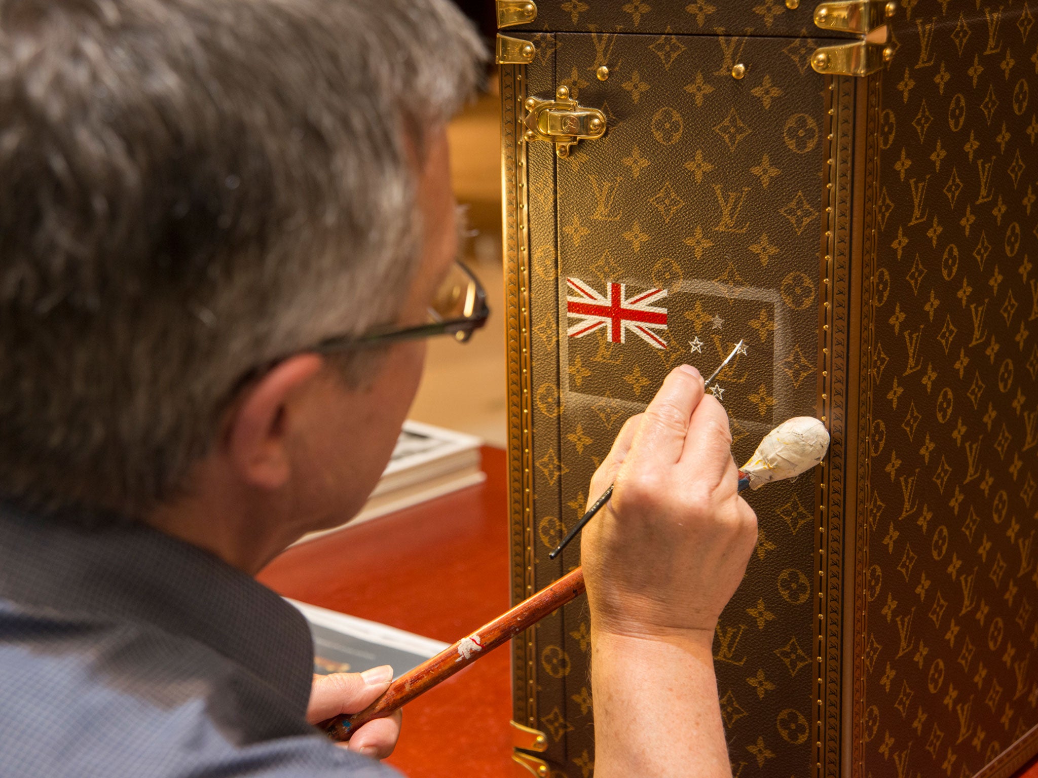 &#13;
The flags of the finalists are painted onto the Louis Vuitton case that will transport the trophy&#13;