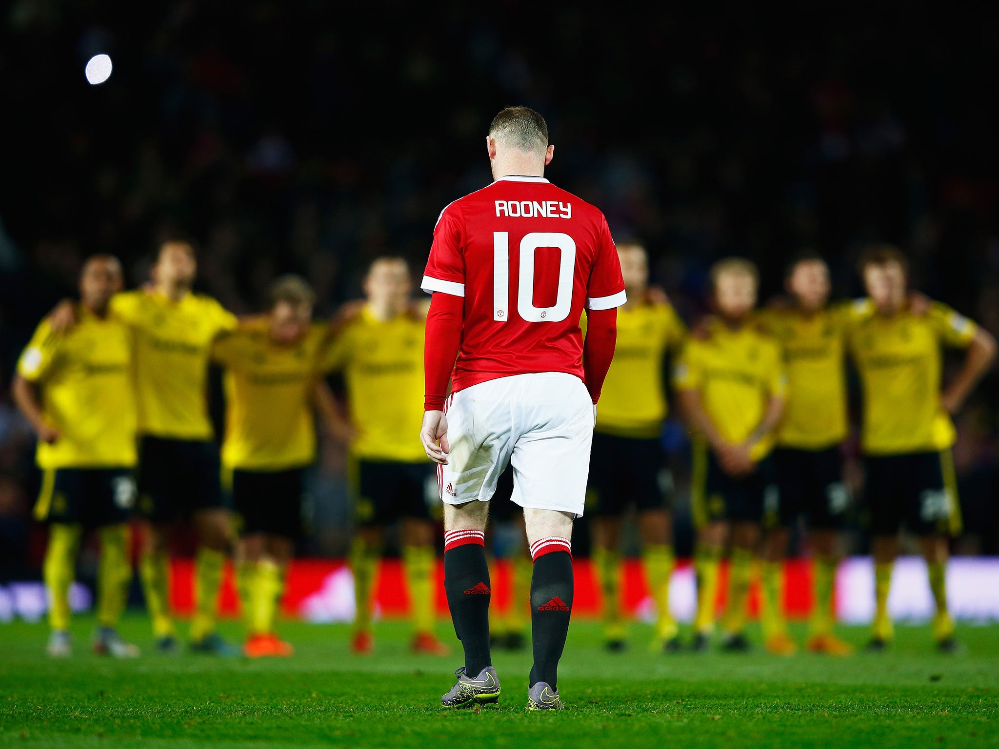 Wayne Rooney walks away after missing his penalty