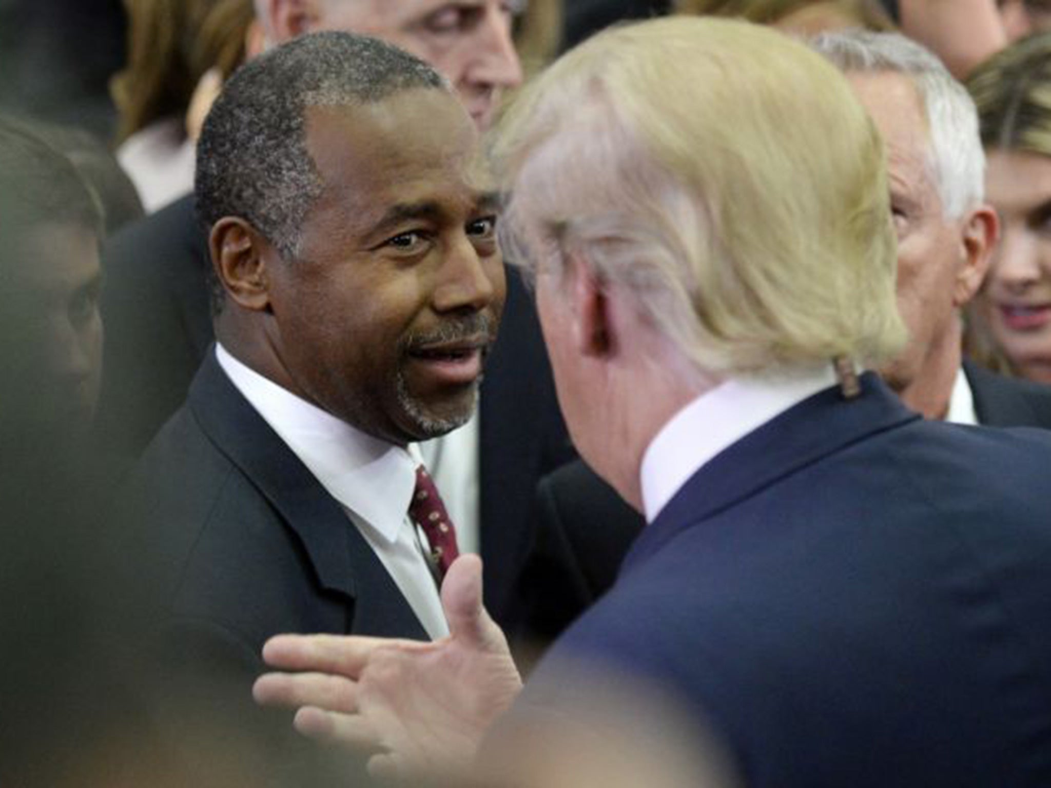 Dr. Ben Carson, left, and Republican presidential candidate Donald Trump talk following the debate