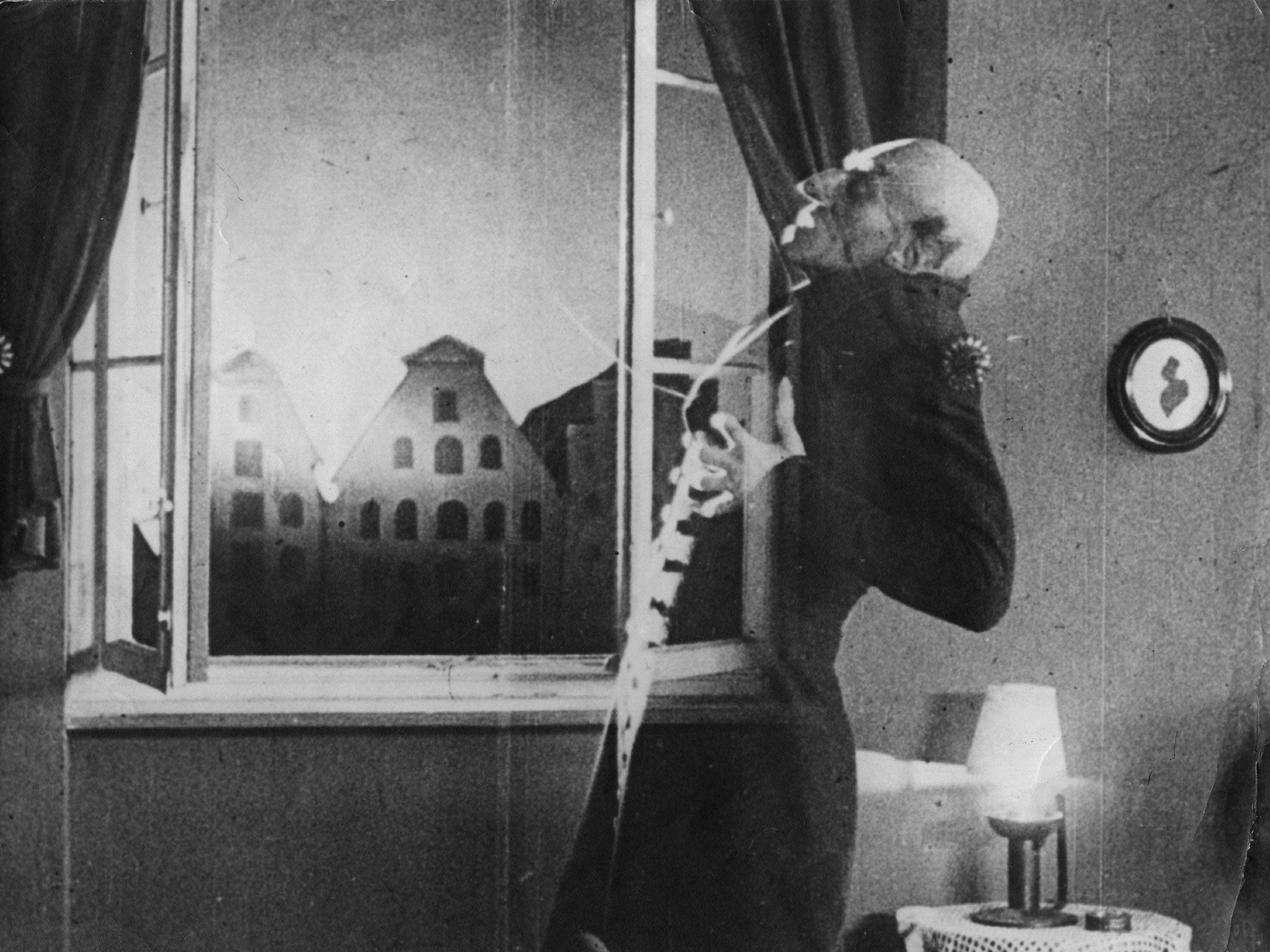 Max Schreck as the vampire Count Orlok, being destroyed by sunlight, in a still from F. W. Murnau's 1921 horror film Nosferatu